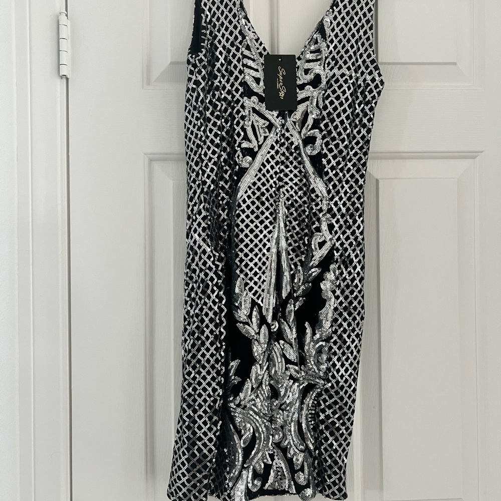 New. Never worn. Sequin sexy mini dress. Glittery and Glam